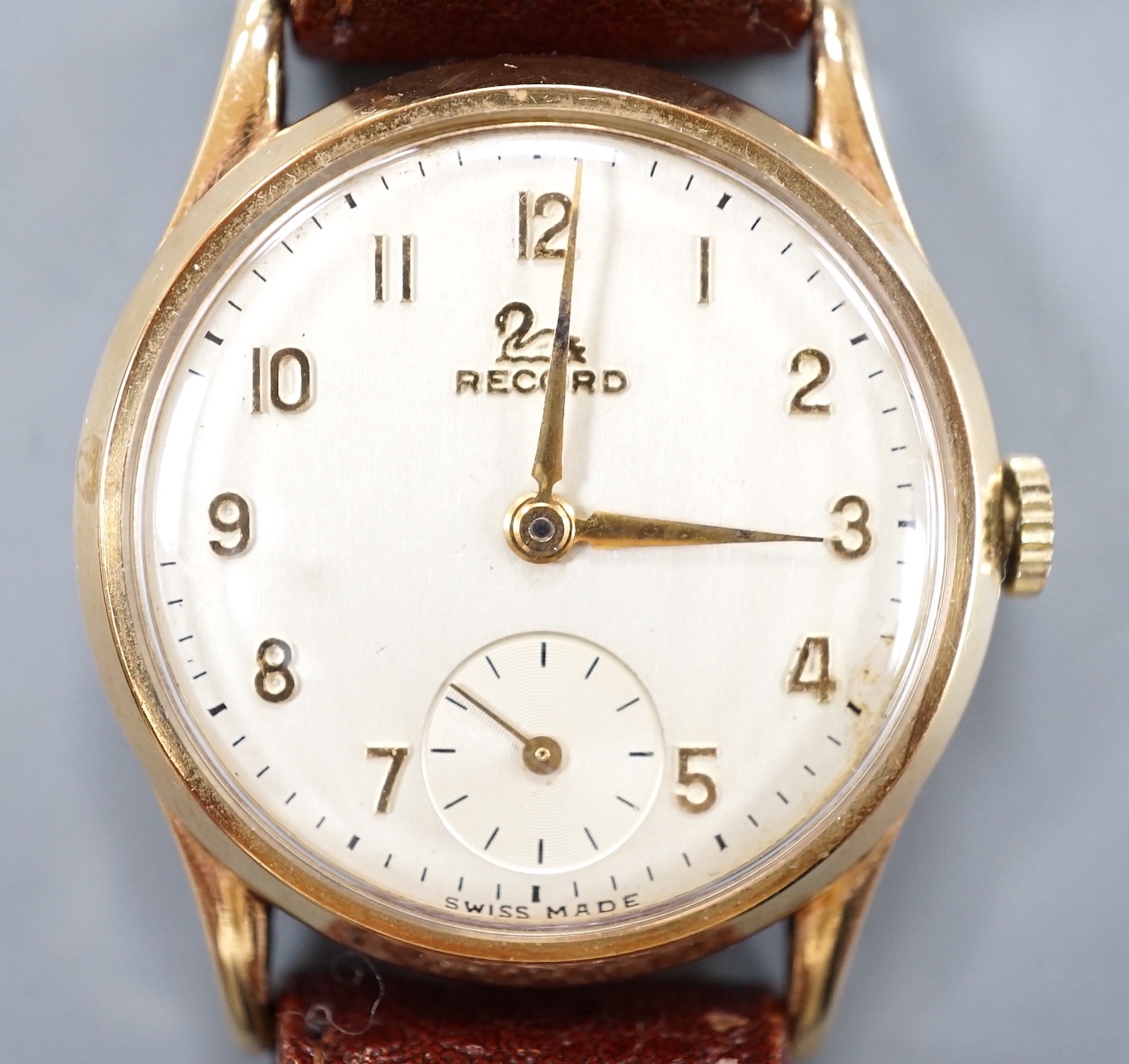 A gentleman's 9ct gold Record manual wind wrist watch, on a brown leather strap, case diameter 32mm